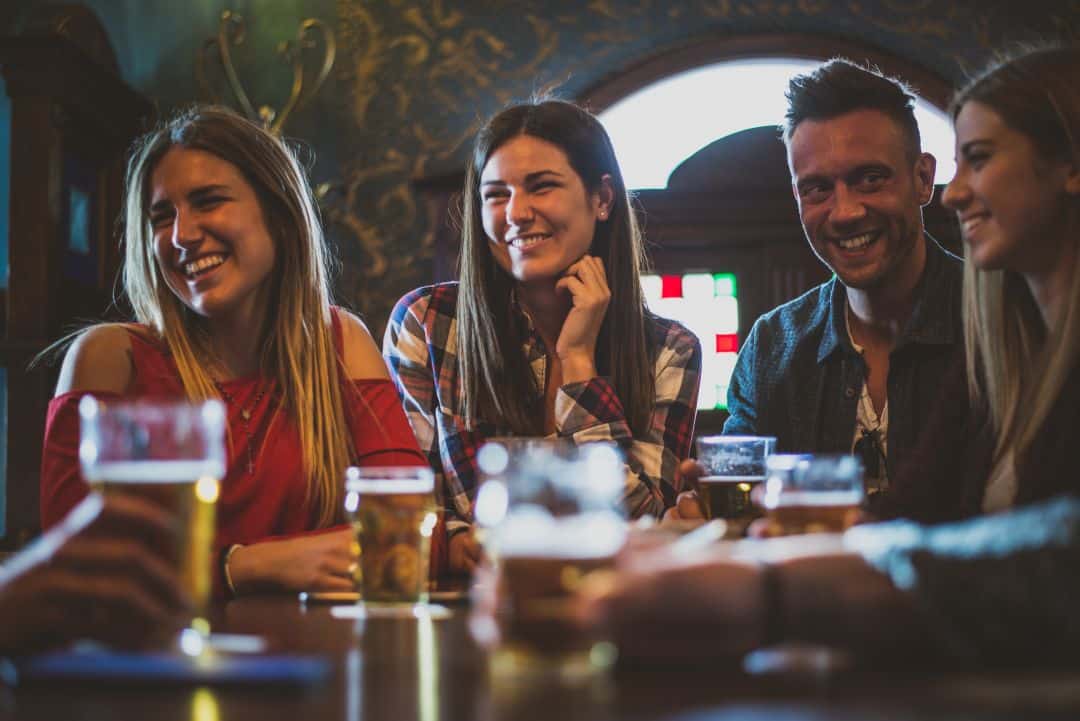 People drinking whilst watching live sport