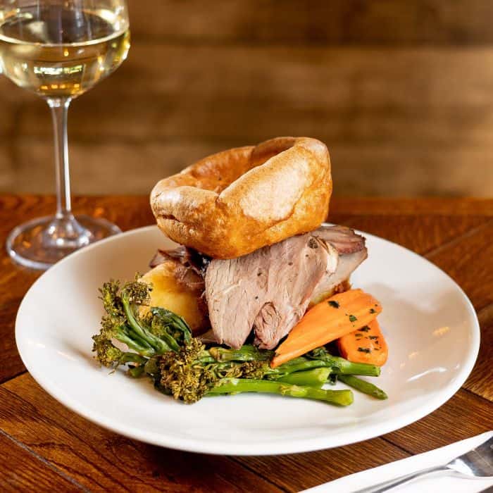 Sunday Roast pub with Roast Beef and a giant yorkshire to top